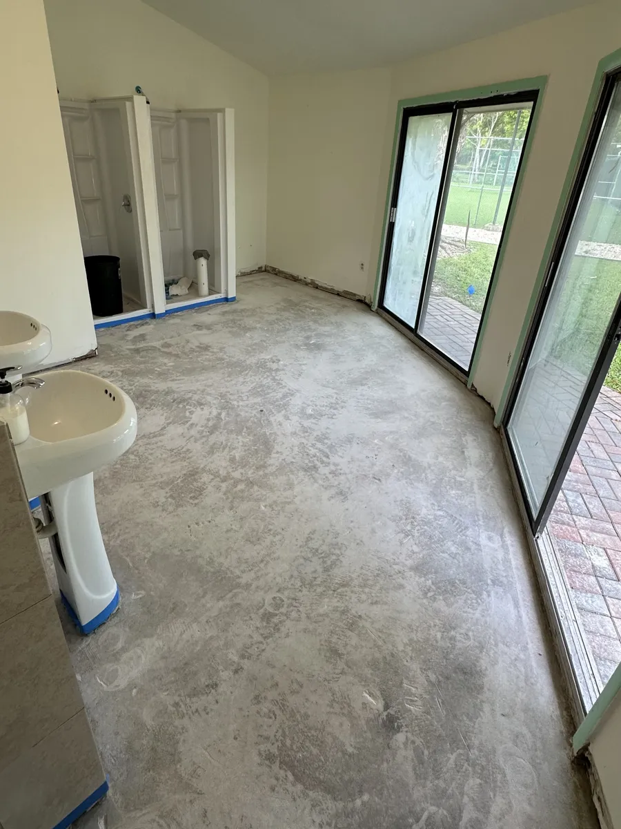 Commercial restroom concrete floor before coating
