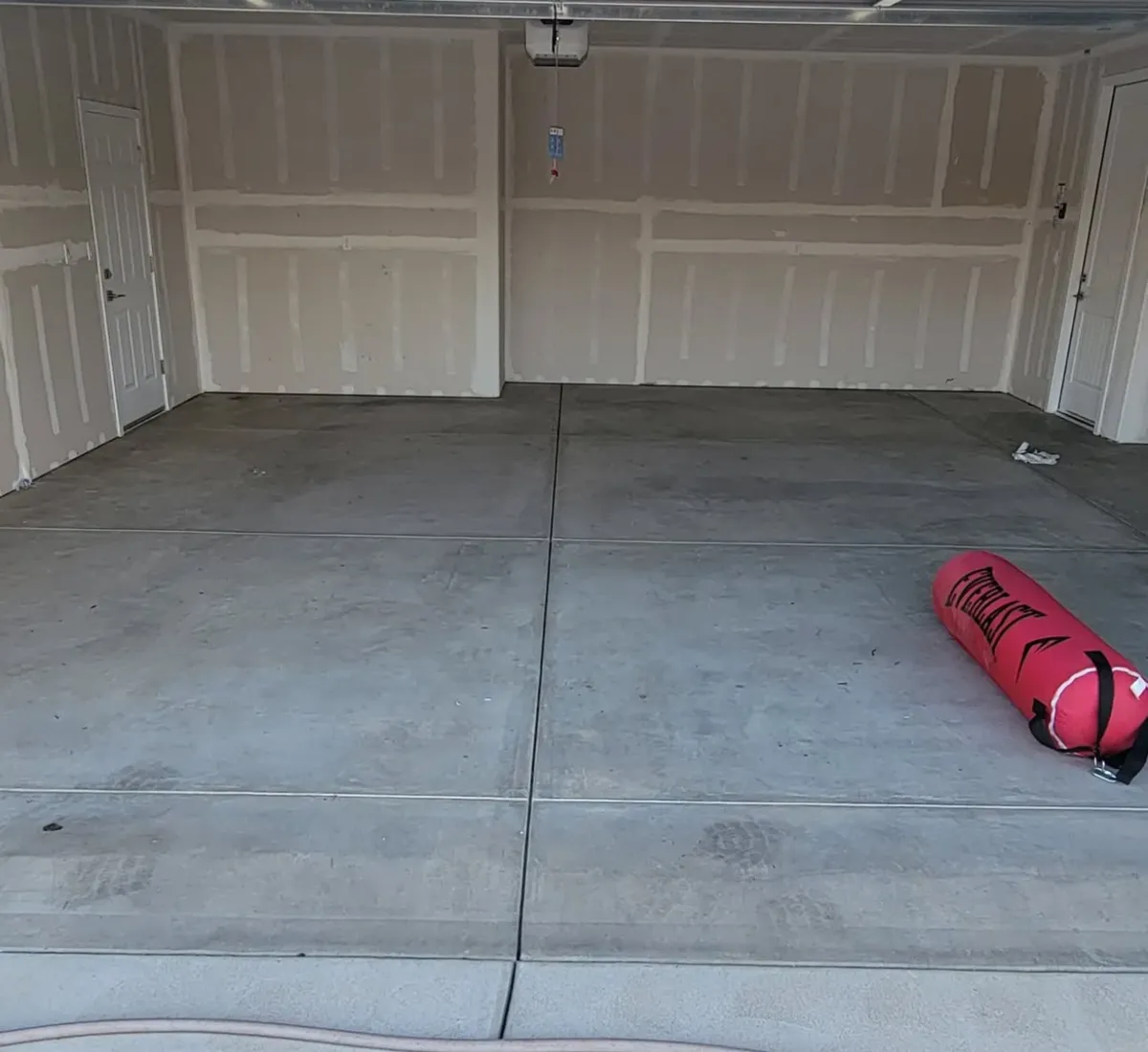 Bare garage concrete slab before floor coating