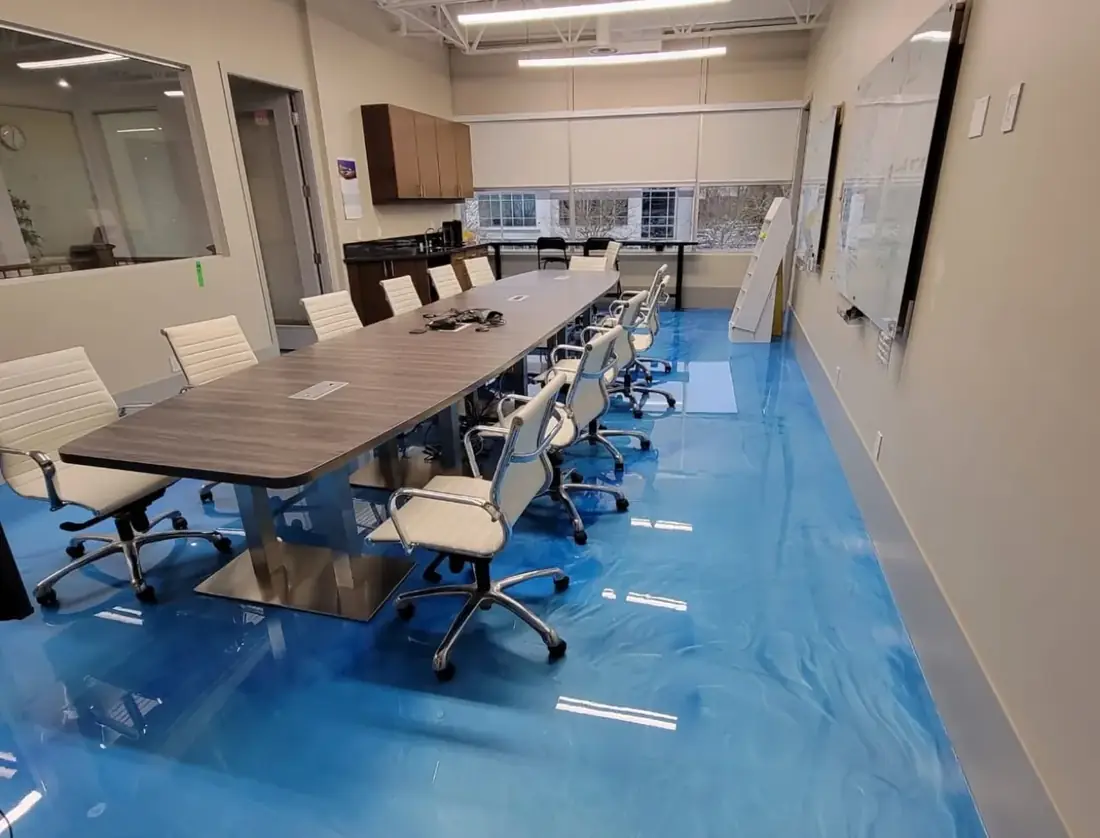 Conference room with a glossy blue metallic floor coating